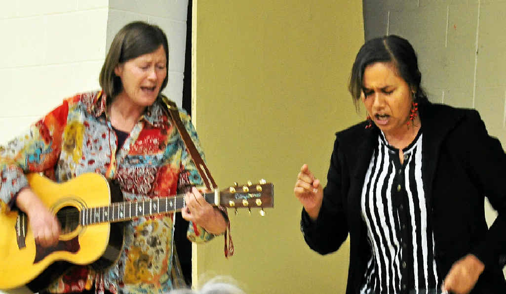 Teacher Sharman Parsons performs an original song with the help of Bernadine Bradshaw on guitar. Teacher Sharman Parsons performs an original song with the help of Bernadine Bradshaw on guitar.